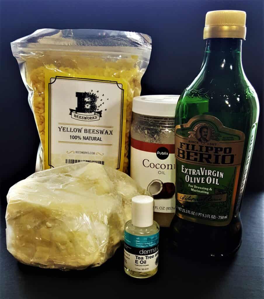 Natural ingredients for homemade paw balm. Shea butter, beeswax, olive oil and coconut oil.