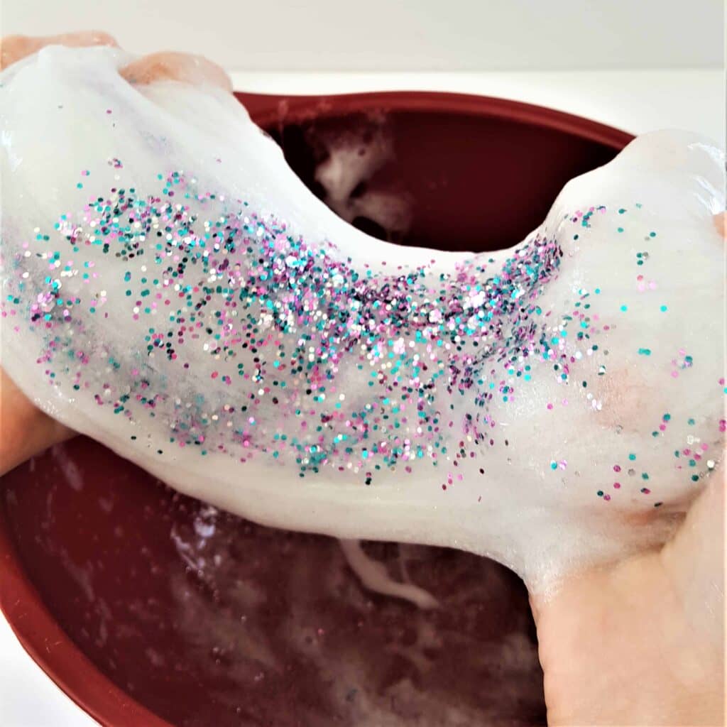 Mermaid Slime - Slimmer & Shine Slime | Mermaid Slime is the ultimate glitter slime! It has a wonderfully unique and fun texture. Using a clear slime base makes this an easy and fun kids craft!