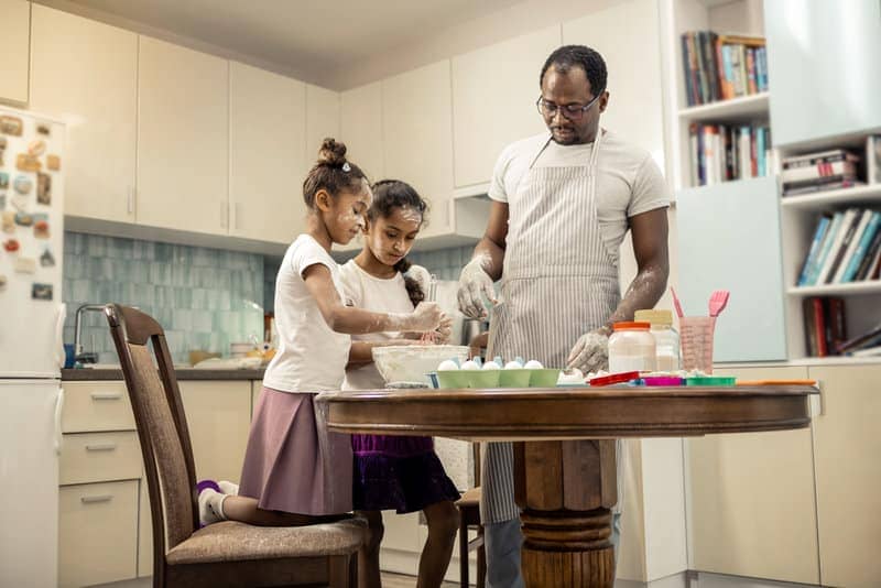 Family cooking together as an example of sustainability for kids
