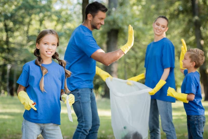 Family picking up trash together